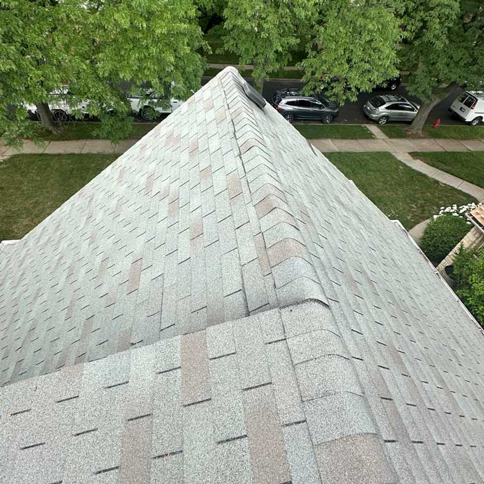 Contractor installing roof shingles in Greenfield WI