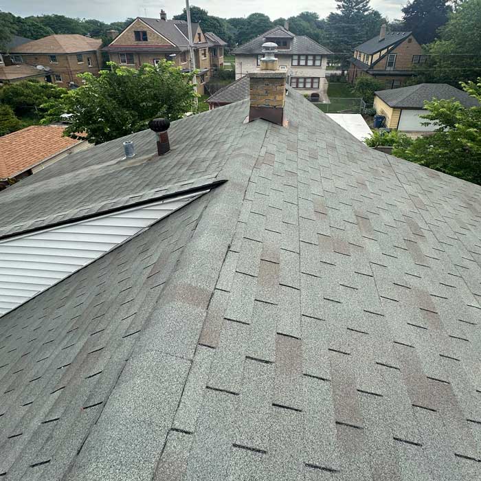 Contractors installing a new roof on a home in Pewaukee, Wisconsin