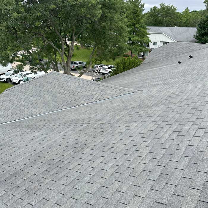 Crew completing a new roof installation on a home in Waukesha, Wisconsin