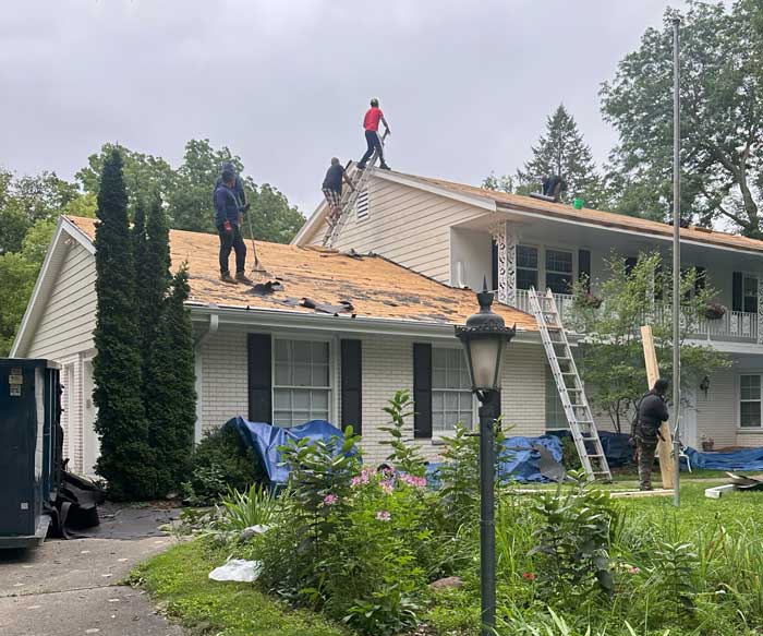 Roofers installing a new roof in Germantown