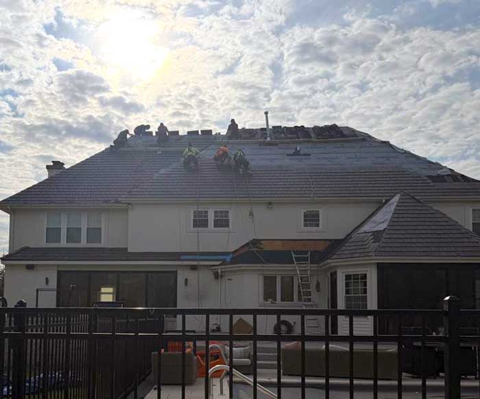 Roof installation team working in Menomonee Falls Wisconsin